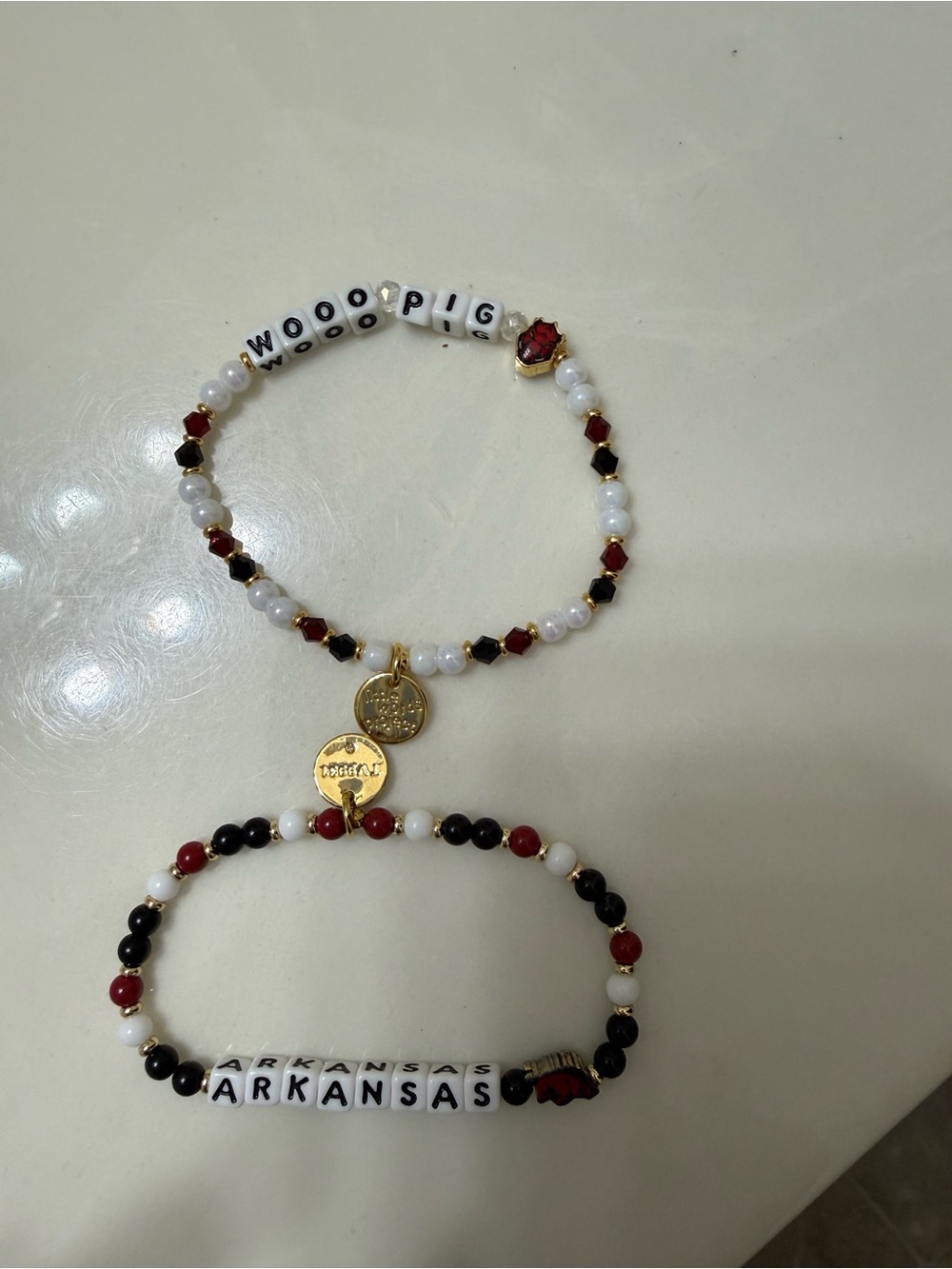 Set of little words project Arkansas bracelets